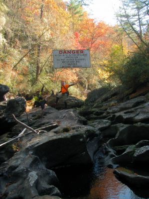 John and Badger gnome posing at the welcome sign 
