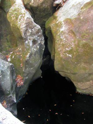 Looking under 'the blockage' at the lower end of the slot canyon. I am happy I did not attempt to dive under this as the other side is blocked. 
