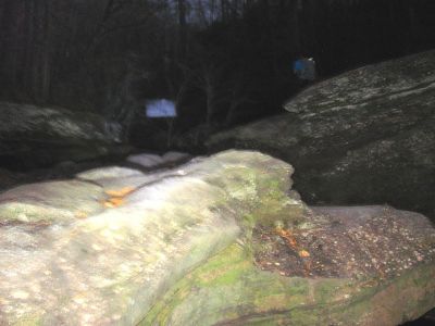 using a flash i could see the signs hanging overhead as we approached the dam / spillway in total darkness. it was interpreted to say ' Goodbye RAT and friends ! we hope you enjoyed your day! '
