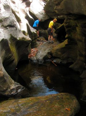 Looking back at Tyler and John as I climb the fish rock 
