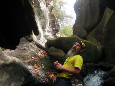 John in the gut of the slot canyon beside the falls there
