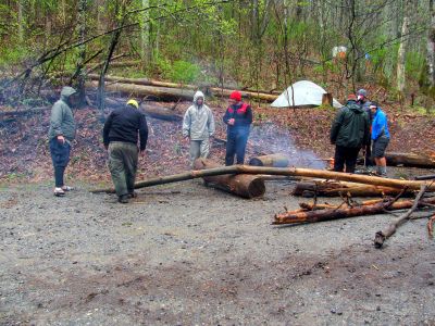 Hikers being creative on cutting up firewood,,
