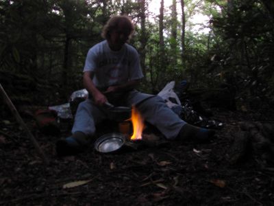 Bol'Dar cooking the first night's supper on his alcohol stove
