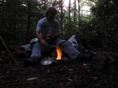 Bol'Dar cooking the first night's supper on his alcohol stove
