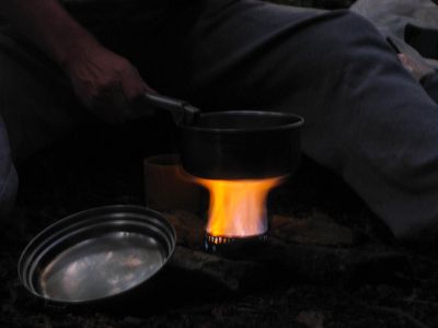 Bol'Dar cooking the first night's supper on his alcohol stove
