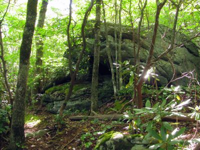 Large rock with small cave
