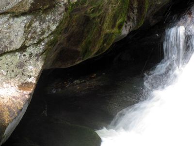 light shining through the large pothole at the base of Bard Falls
