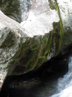 light shining through the large pothole at the base of Bard Falls
