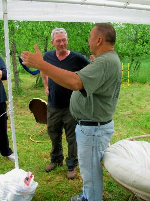 Ben telling a fish story,,, "I swear, that sob was this long" !!! 
