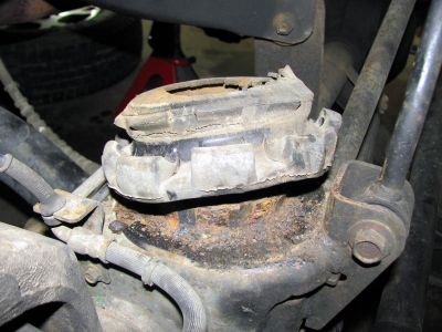 Badly worn and dry rotted rubber isolators and rusted frame towers 
