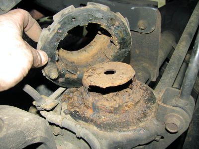 Badly worn and dry rotted rubber isolators and rusted frame towers 
