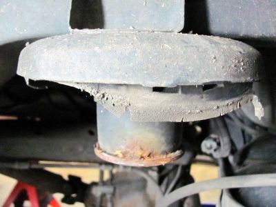 top isolator on rear coil ,, badly squished and worn 
