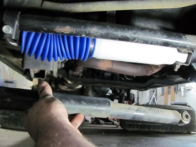 To prevent death wobble I installed a new high perf offroad steering damper shock, out with old and in with new. 
