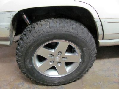new rims /tires mounted .  These are JK take offs and are 255/75.17 so the tires are 32.5 inches tall. 
