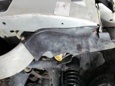 Again, saving the plastic inner fender I wrapped it around the reservoir and screwed it to the metal bumper
