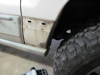 Now to trim the back of the front fenders. First thing, remove the trim. 
