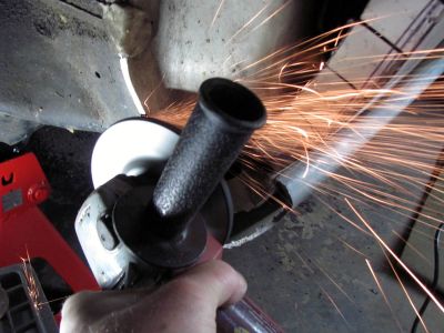 Grinding the pinch weld back on driver side 
