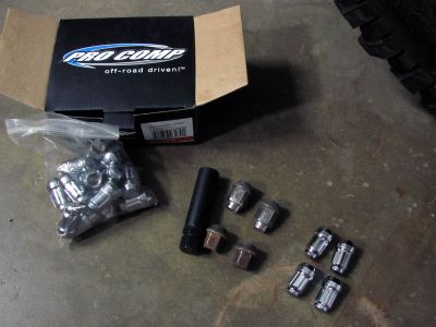 Doing away with those crappy factory lug nuts and replacing with Pro Comp off road ones. 
