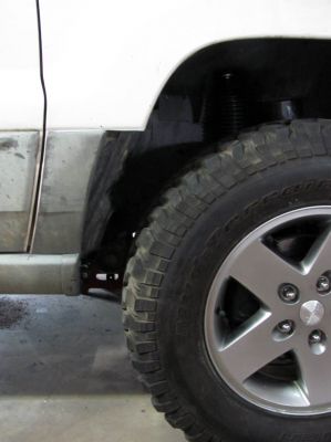AFTER trimming the fender (I will trim that top part later after I see if I go with a bushwhacker flare OR if I do something custom) For now I have all the clearance i need and it doesnt look that bad but that will get trimmed eventually !!! 
