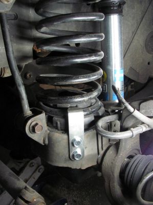 Coil spring retainer installed on driver side (remember that tower was rusted nearly gone ??)  Just one less thing to worry about when going down the trail !! 
