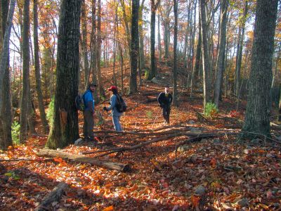 Tyler, Larry, and John taking a break on top before we begin our steep descent down the other side to find the cliffs
