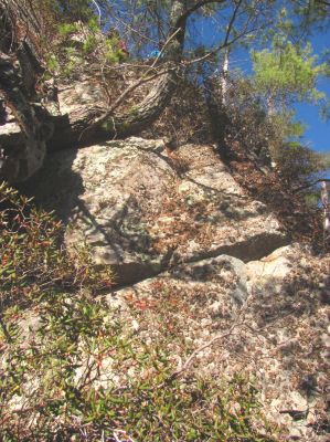 Looking up at Tyler who is back at the top of the crack. He was the first one down and back before any of the rest of us went down but, he eventually came back down again to join John and I to continue much farther down to explore the cliffs more thoroughly 
