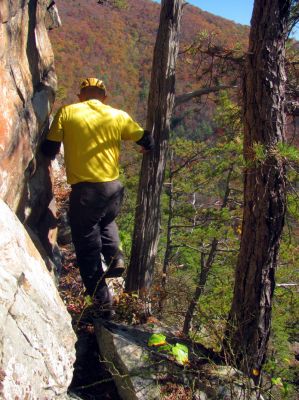 John makes his way along the ledge to get back to the point 
