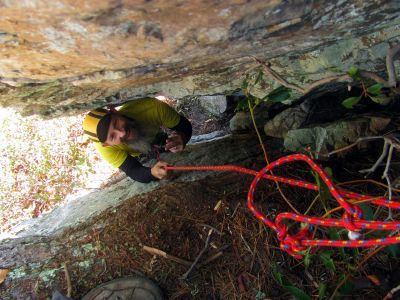 John begins his climb back up the crack. 
