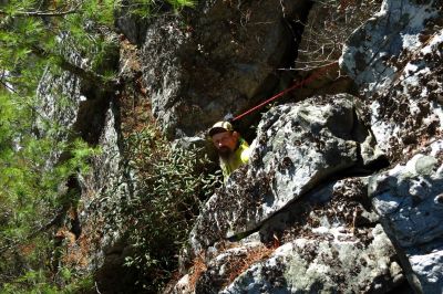 John going down the crack on the rope 
