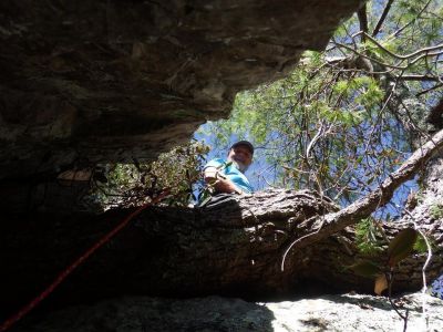 Me standing on the pine tree root half way up the crack as seen by John who is on the rope below (Photo by John Forbes) 
