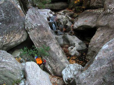 Badger approaches a large crack that we would go through to get farther upstream 
