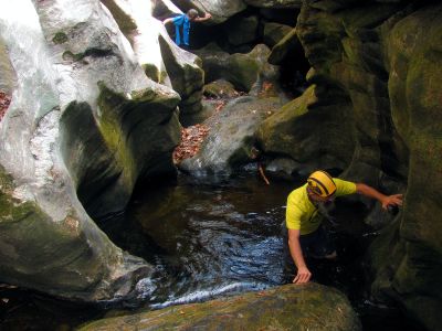 John crossing the pool in the slot canyon 
