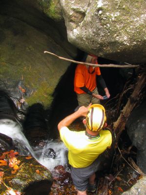 John and Badger at the base of the falls within the slot canyon. again i reiterate that where Badger is standing is where the drain is clogged in the slot canyon as it is no long r possible to descend into the cave below and swim out the lower side.  it was my thoughts that this could burst through at any moment 
