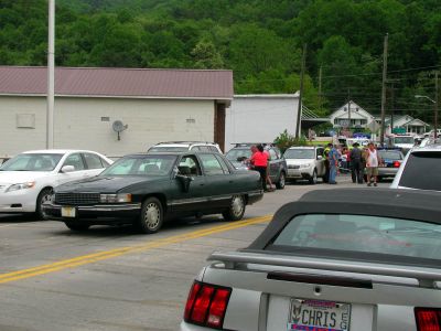 Another pic of the cadillac. You can see the mirror hanging that my right arm knocked loose as it struck us. My daughter was knocked to the ground with us and as she spun around her head nearly missed the left rear tire by less than 2 inches. 
