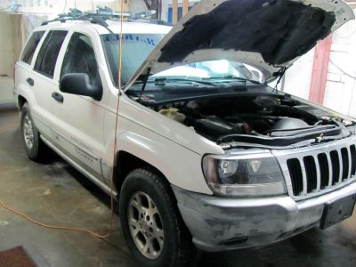 1999 Jeep Grand Cherokee Laredo / 4.0L  BEFORE  installing a 2.5 inch spacer lift kit from Supreme Suspensions, Bilstein shocks, and a front driveshaft conversion from Rzeppa/Rzeppa type (CV)  to a Double Cardan type (U Joint) . 
